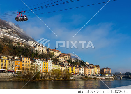 Image of cable cars in Grenoble in autumn over riverside 112822681