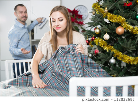 Woman laying tablecloth Woman laying tablecloth 112822695