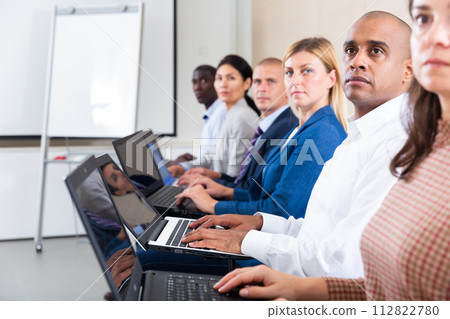 international group of businessmen with computer at world training courses 112822780