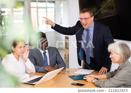 Group of different people arguing at table in office Group of different people arguing at table in office 112822855