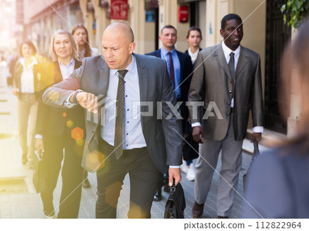 Portrait of hurrying man Portrait of hurrying man 112822964