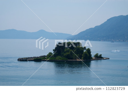 Monastery on the water, over which planes take off and land Greece Corfu island Vlacherna Monastery  112823729