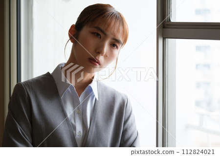 Portrait of a woman working from home Portrait of a woman working from home 112824021
