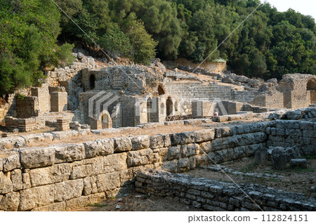 Ruins of Great Basilica in Butrint National Park, Buthrotum, Albania. Triconch Palace at Butrint Life and death of an ancient Roman house Historical medieval Venetian Tower surrounded. High quality Ruins of Great Basilica in Butrint National Park, Buthrotum, Albania. Triconch Palace at Butrint Life and death of an ancient Roman house Historical medieval Venetian Tower surrounded. High quality 112824151