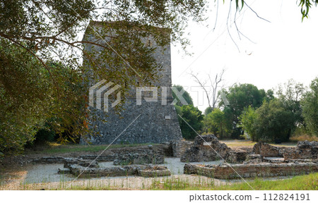 Ruins of Great Basilica in Butrint National Park, Buthrotum, Albania. Triconch Palace at Butrint Life and death of an ancient Roman house Historical medieval Venetian Tower surrounded. High quality Ruins of Great Basilica in Butrint National Park, Buthrotum, Albania. Triconch Palace at Butrint Life and death of an ancient Roman house Historical medieval Venetian Tower surrounded. High quality 112824191