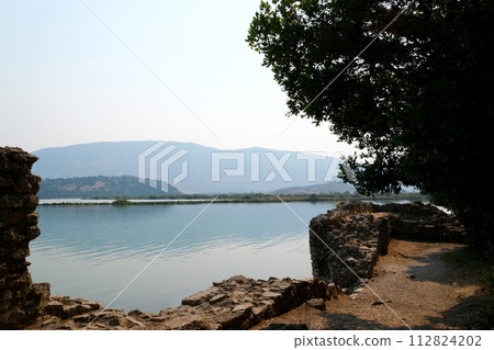 Ruins of Great Basilica in Butrint National Park, Buthrotum, Albania. Triconch Palace at Butrint Life and death of an ancient Roman house Historical medieval Venetian Tower surrounded. High quality Ruins of Great Basilica in Butrint National Park, Buthrotum, Albania. Triconch Palace at Butrint Life and death of an ancient Roman house Historical medieval Venetian Tower surrounded. High quality 112824202