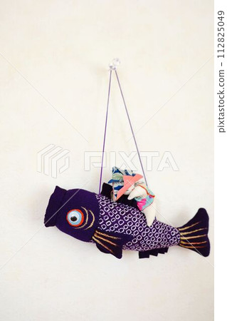 A child is riding on a carp streamer swimming in the sky 2 A child is riding on a carp streamer swimming in the sky 2 112825049