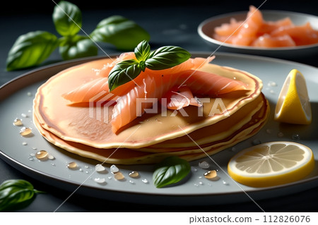 thin pancakes with lightly salted red fish 112826076