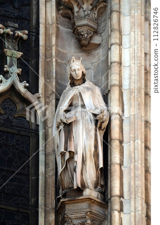 Statue of Saint on the facade of the Milan Cathedral, Duomo di Santa Maria Nascente, Milan, Lombardy, Italy Statue of Saint on the facade of the Milan Cathedral, Duomo di Santa Maria Nascente, Milan, Lombardy, Italy 112826746
