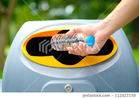 Please dispose of plastic bottle into the tank. A man throw rubbish in the trash can by separate garbage to dispose like hazardous waste , Please dispose of plastic bottle into the tank. A man throw rubbish in the trash can by separate garbage to dispose like hazardous waste , 112827150