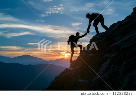 Silhouette of couple hiking help each other silhouette in mountains with sunlight Silhouette of couple hiking help each other silhouette in mountains with sunlight 112828282