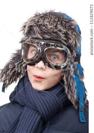 Smiling boy in winter attire with pilot goggles Smiling boy in winter attire with pilot goggles 112829073