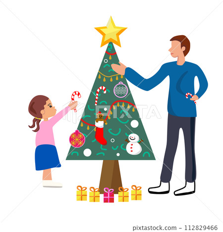 Father and daughter arranging decorations on Christmas tree.  112829466