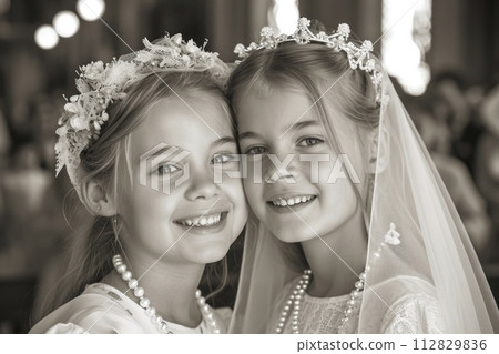 Sacred milestone: capturing the essence of first communion in a tender and symbolic portrayal, where young believers embrace the solemnity and spirituality of this significant rite 112829836