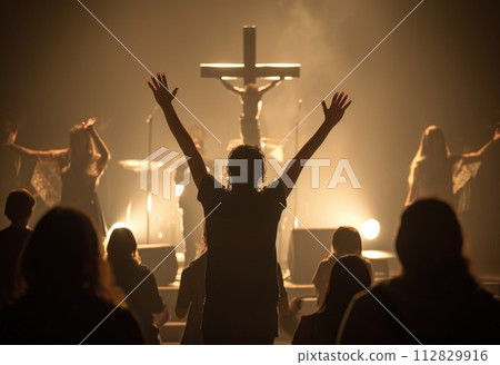 Capturing divine moments: church worship concept Christians, raised hands, earnestly pray and worship to cross in the sacred ambiance of a church building, expressing faith and spiritual connection. 112829916