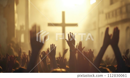 Capturing divine moments: church worship concept Christians, raised hands, earnestly pray and worship to cross in the sacred ambiance of a church building, expressing faith and spiritual connection. 112830061