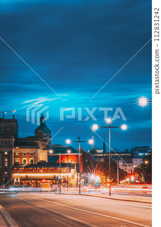 Stockholm, Sweden. Scenic Skyline View Of Famous Tower Of Stockholm City Hall And St. Clara Or Saint Klara Church. Popular Destination Scenic View In Sunset Twilight Dusk Lights. Evening Lighting Stockholm, Sweden. Scenic Skyline View Of Famous Tower Of Stockholm City Hall And St. Clara Or Saint Klara Church. Popular Destination Scenic View In Sunset Twilight Dusk Lights. Evening Lighting 112831242