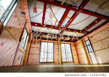 Custom-built house under construction... Heavy steel beams Custom-built house under construction... Heavy steel beams 112831962