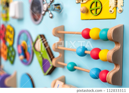 Close -up wooden panel for children's development 112833311