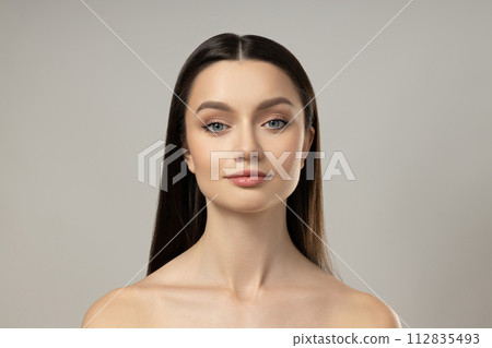 Attractive young girl on a gray background. Botox concept 112835493