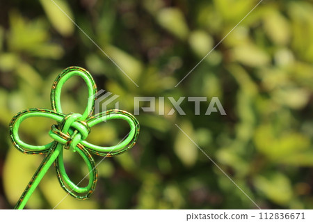 Green background with clover mizuhiki decoration Green background with clover mizuhiki decoration 112836671