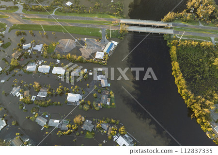 Flooded houses by hurricane Ian rainfall in Florida residential area. Consequences of natural disaster Flooded houses by hurricane Ian rainfall in Florida residential area. Consequences of natural disaster 112837335