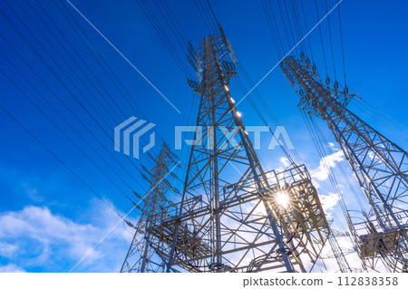 Japan's Sagamihara cityscape, with countless high voltage lines shining against the blue sky 112838358