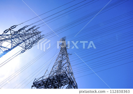 Japan's Sagamihara cityscape, with countless high voltage lines shining against the blue sky 112838363