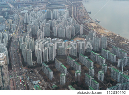 Aerial view of Seoul Downtown Skyline, South Korea. Financial district and business centers in smart urban city in Asia. Skyscraper and high-rise buildings. Aerial view of Seoul Downtown Skyline, South Korea. Financial district and business centers in smart urban city in Asia. Skyscraper and high-rise buildings. 112839692