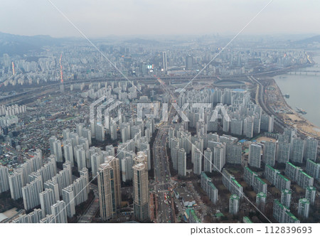 Aerial view of Seoul Downtown Skyline, South Korea. Financial district and business centers in smart urban city in Asia. Skyscraper and high-rise buildings. Aerial view of Seoul Downtown Skyline, South Korea. Financial district and business centers in smart urban city in Asia. Skyscraper and high-rise buildings. 112839693
