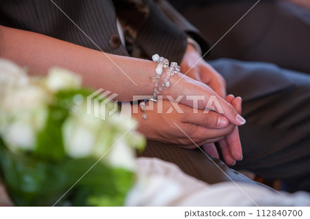 Unseen Bonds: A Moment of Connection at a Formal Gathering 112840700