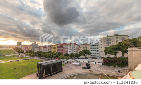 Panorama showing aerial view of Jardim da Alameda in Lisbon with the Luminous Fountain timelapse during sunset. Panorama showing aerial view of Jardim da Alameda in Lisbon with the Luminous Fountain timelapse during sunset. 112841830