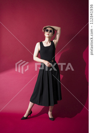 A woman in a black dress A woman in a black dress 112841936