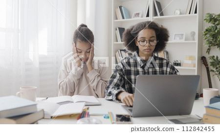 Confused classmates thinking of math problem, looking for answers in internet, studying at home, education Confused classmates thinking of math problem, looking for answers in internet, studying at home, education 112842455