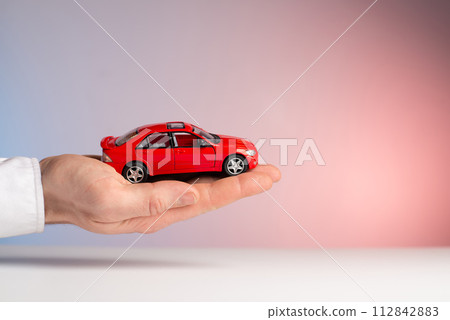 concept : car insurance red car accident in hand concept : car insurance red car accident in hand 112842883