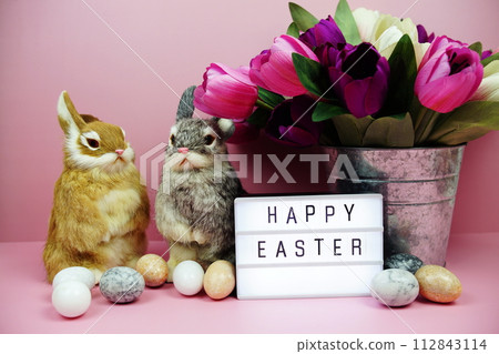 Happy Easter light box with easter element decoration on pink background Happy Easter light box with easter element decoration on pink background 112843114