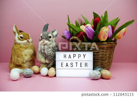 Happy Easter light box with easter element decoration on pink background Happy Easter light box with easter element decoration on pink background 112843115