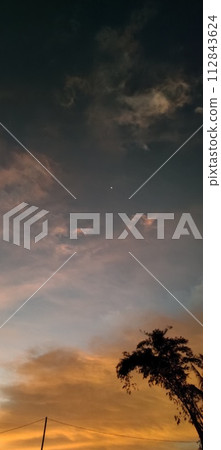 Beautiful twilight and clouds with golden yellow sunlight 112843624