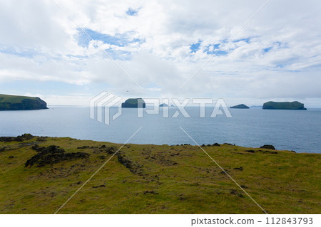 Vestmannaeyjar island beach day view, Iceland landscape.Surtsey island Vestmannaeyjar island beach day view, Iceland landscape.Surtsey island 112843793