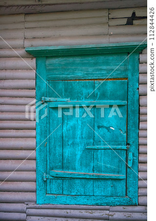 Wooden window shutters 112844426