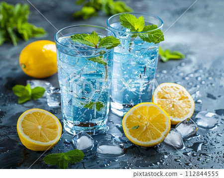 Electrolyte water is water that has been infused with fruits and berries in glass 112844555