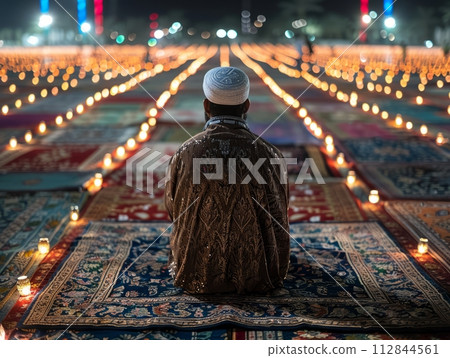 Eid al-Adha Traditions: Moment of Observance Captured 112844561