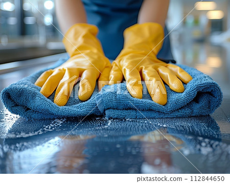 Female cleaner hands in gloves close up, housewife or professional cleaning service working 112844650