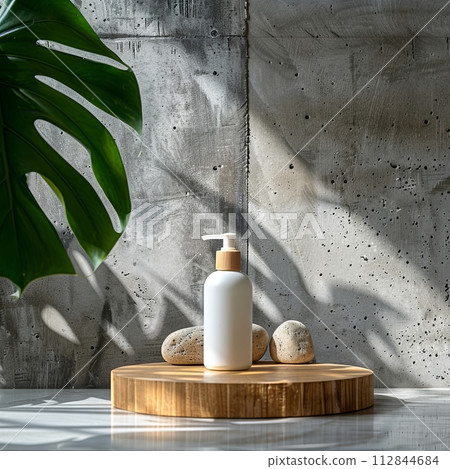 Front view of a small lotion body placed on top of a wooden podium inspired by nature, monstera plant and concrete wall 112844684