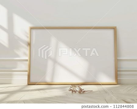 Blank picture frame on the parquet floor in room 112844808