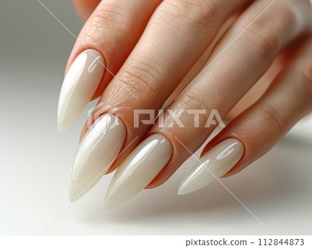 Close up of a woman hand with a professional clear white nail work 112844873