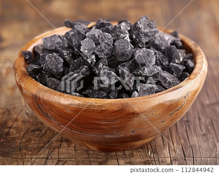 Black salt is a type of rock salt in bowl , South Asian cuisine 112844942