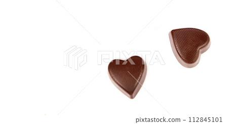 Chocolate candies isolated on white. Free space for text. Wide photo. 112845101