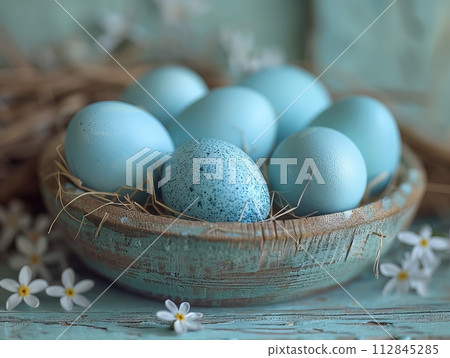 Blue easter eggs in tray with flowers Blue easter eggs in tray with flowers 112845285