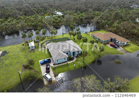 Flooded houses by hurricane rainfall in Florida residential area. Consequences of natural disaster Flooded houses by hurricane rainfall in Florida residential area. Consequences of natural disaster 112846469